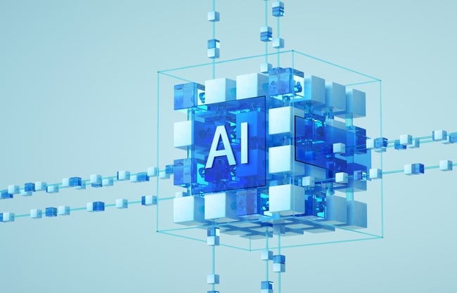 3D illustration of a glowing blue cube labeled “AI,” composed of smaller interconnected cubes representing artificial intelligence and data systems integration. 3D illustration of a glowing blue cube labeled “AI,” composed of smaller interconnected cubes representing artificial intelligence and data systems integration.