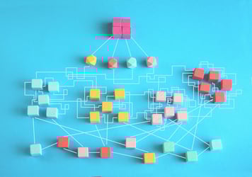 Illustration of disjointed and mismatched 3D blocks, symbolizing the complexity and fragmentation in legacy ICM platforms.
