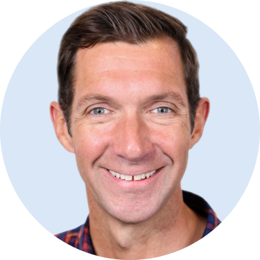 Grayson Headshot 375px Blue Background